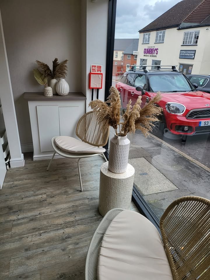 Relaxed seating by the window at Vanity Hair in Studley
